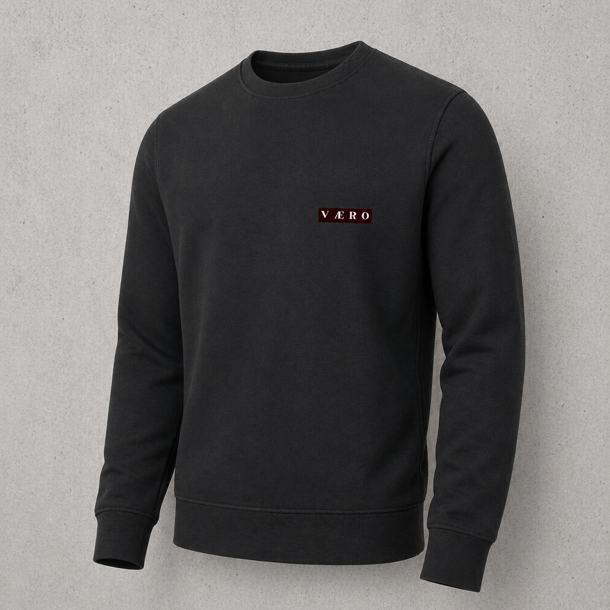Black sweatshirt with a red and white logo on a gray background