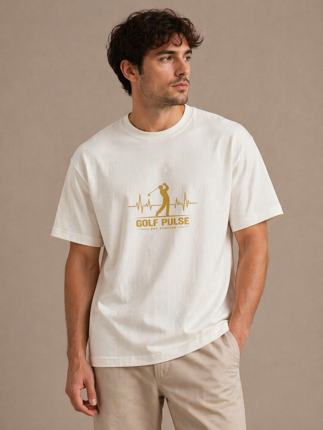 Man wearing a white t-shirt with a logo and text on a beige background