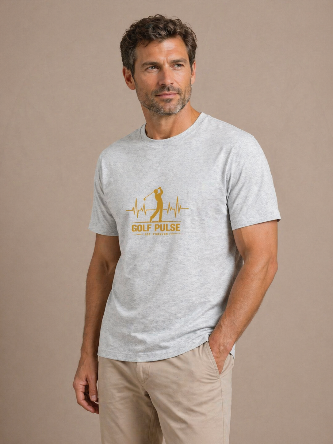 Man wearing a gray t-shirt with a yellow graphic and text on a beige background