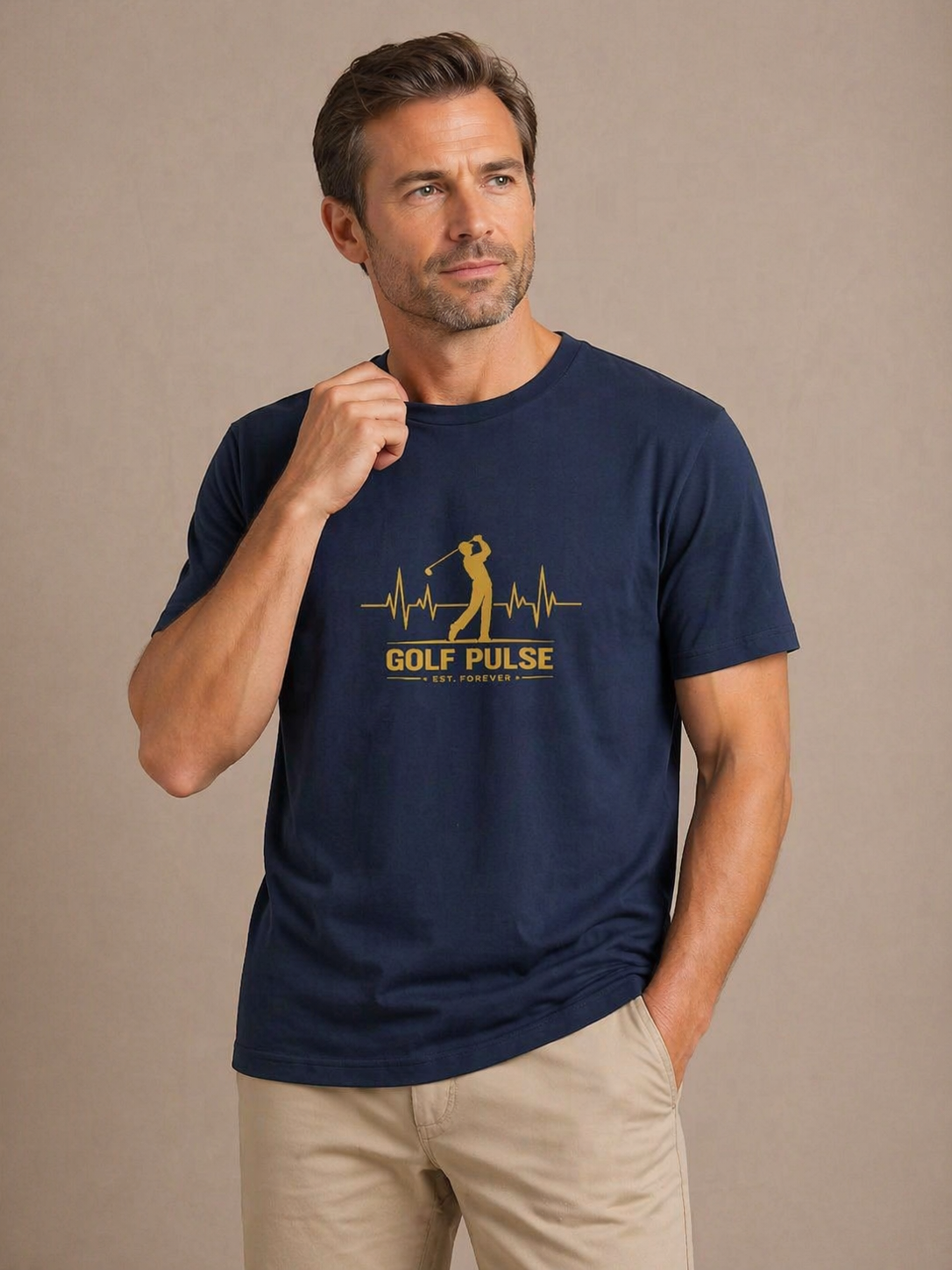 Man wearing a navy blue t-shirt with 'Golf Pulse' design on a beige background