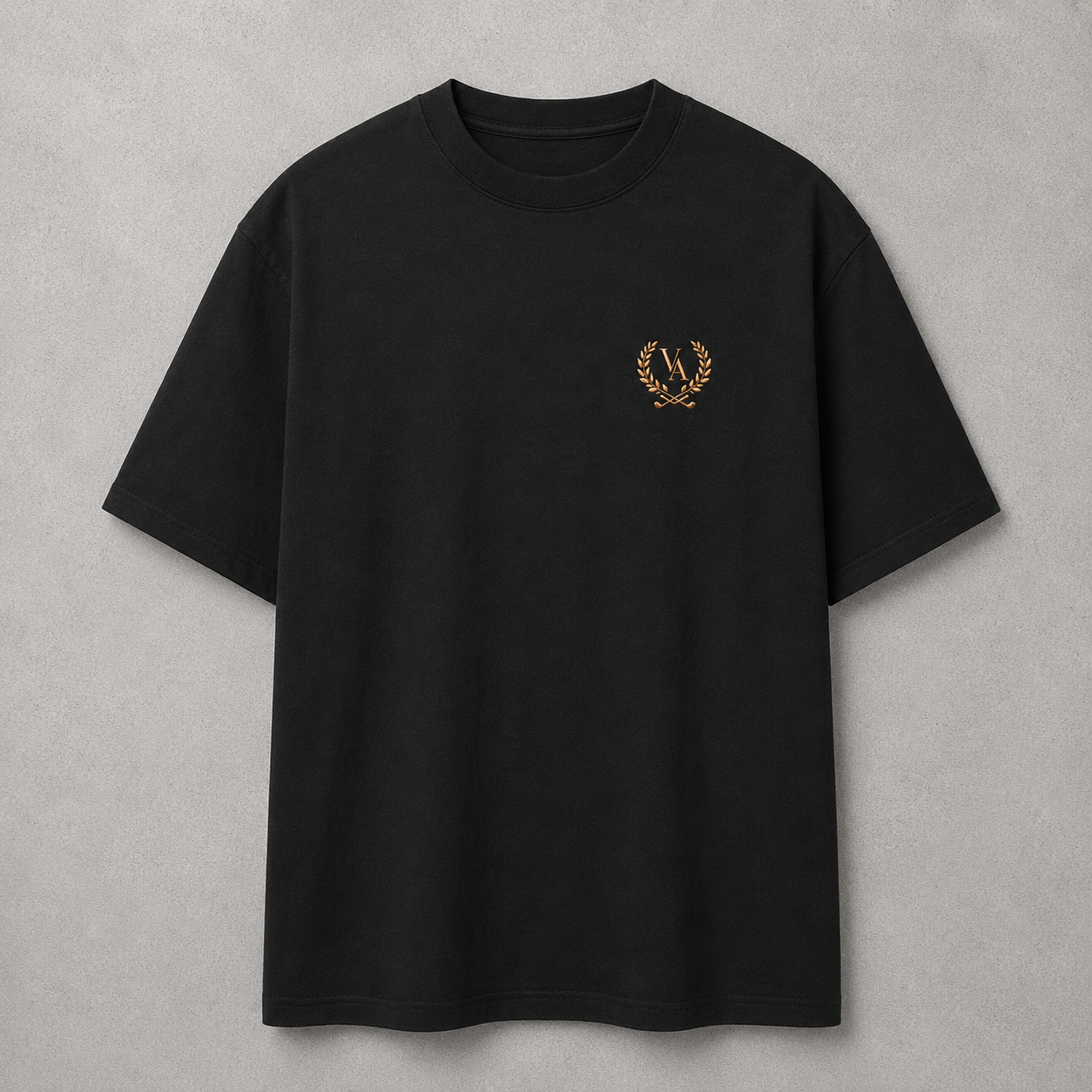 Black t-shirt with a gold emblem on a gray background