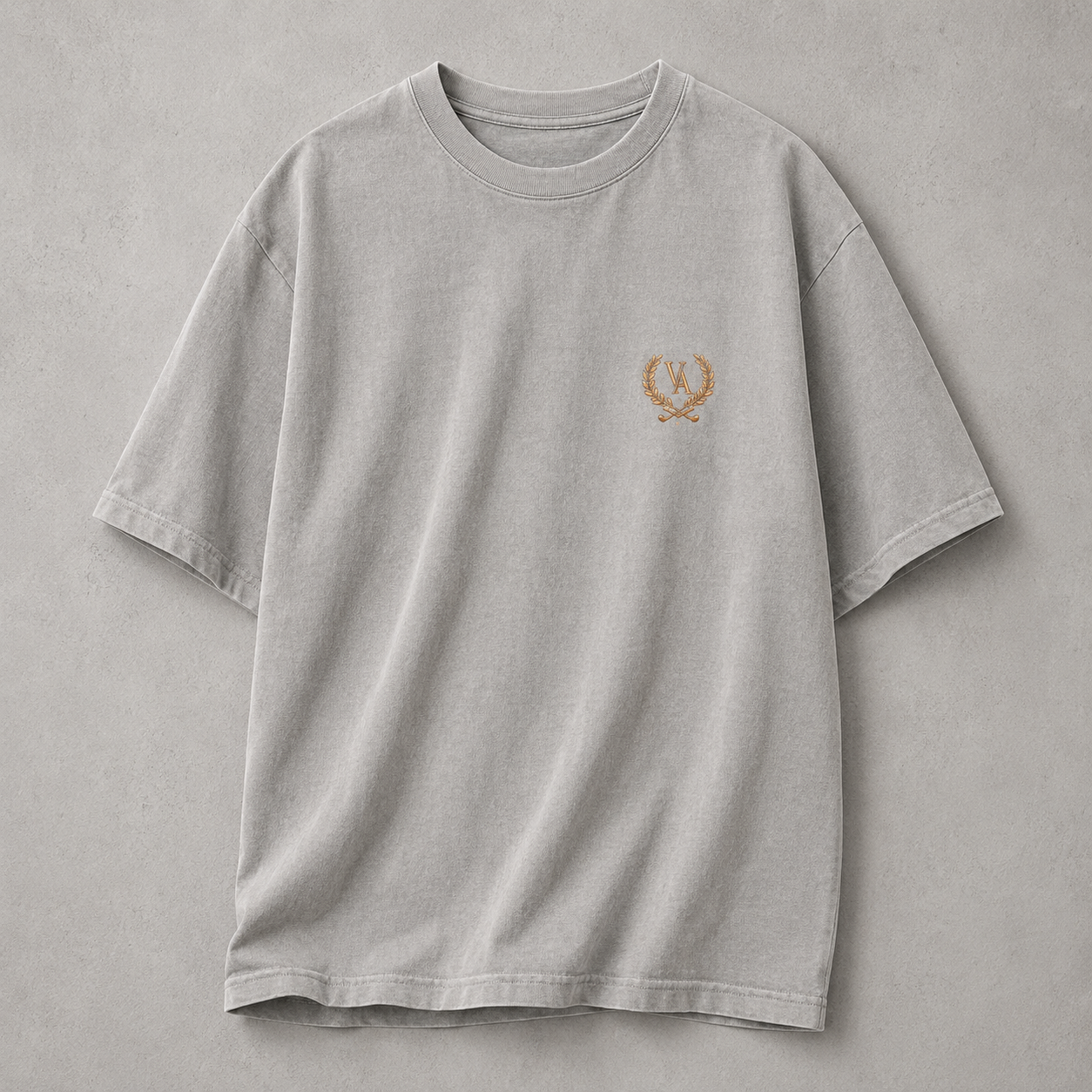 Gray t-shirt with a small logo on a gray background