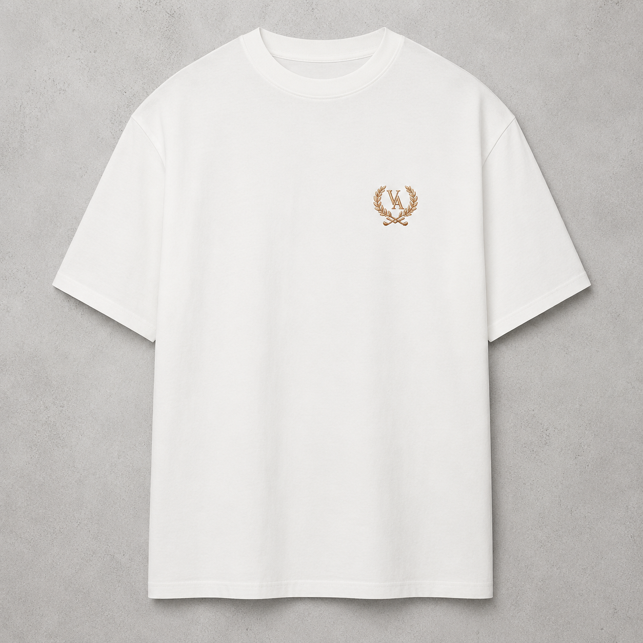 White t-shirt with a gold emblem on a gray background