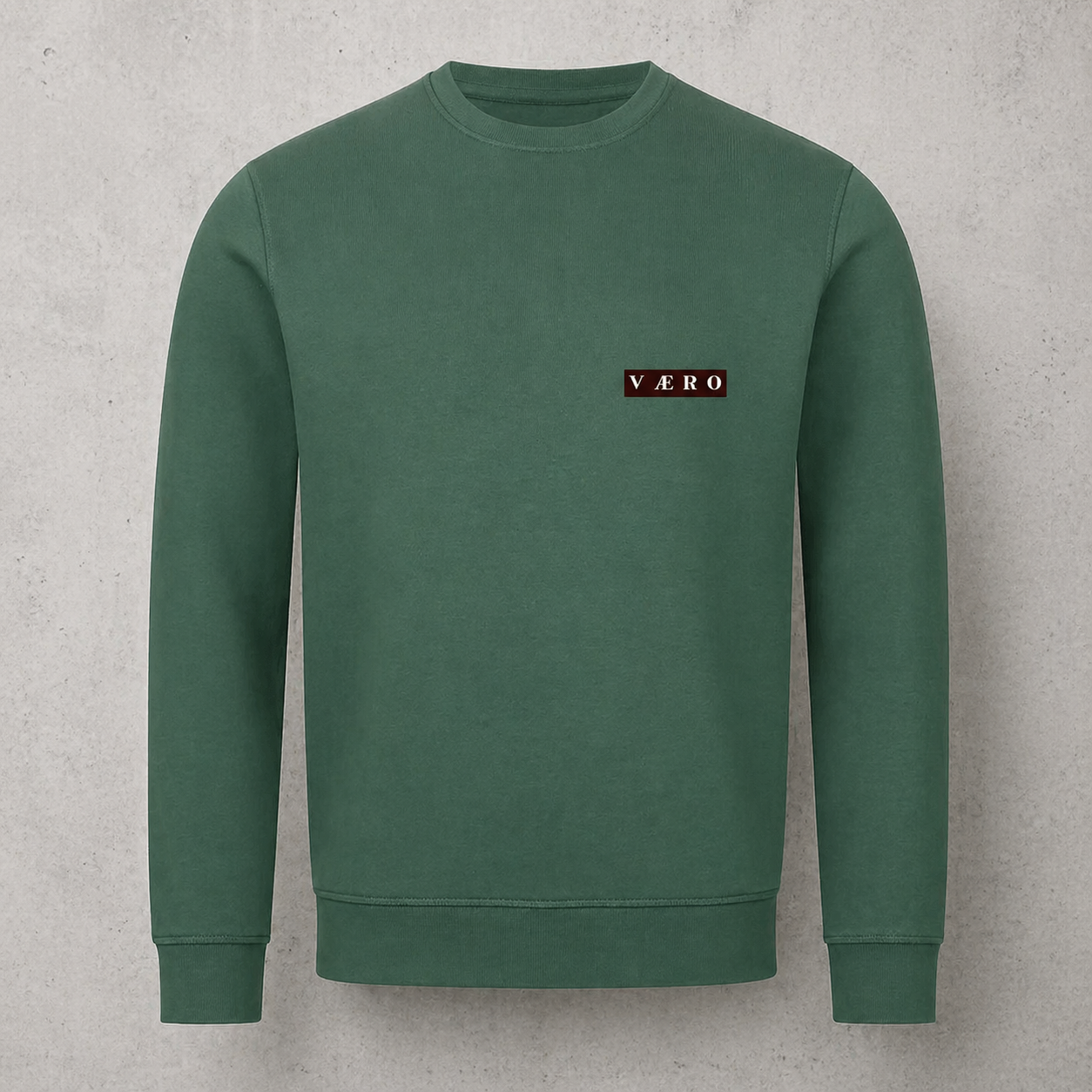 Green sweatshirt with a logo on a gray background