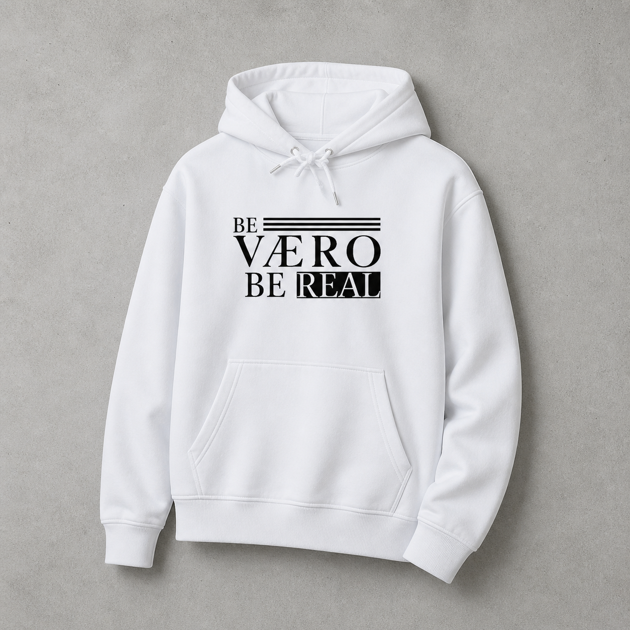 White hoodie with 'Be Vaero Be Real' text on a gray background