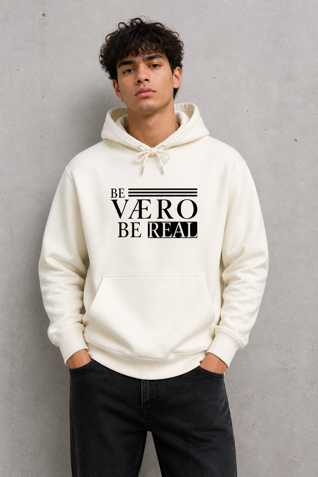 Person wearing a white hoodie with text design against a gray background