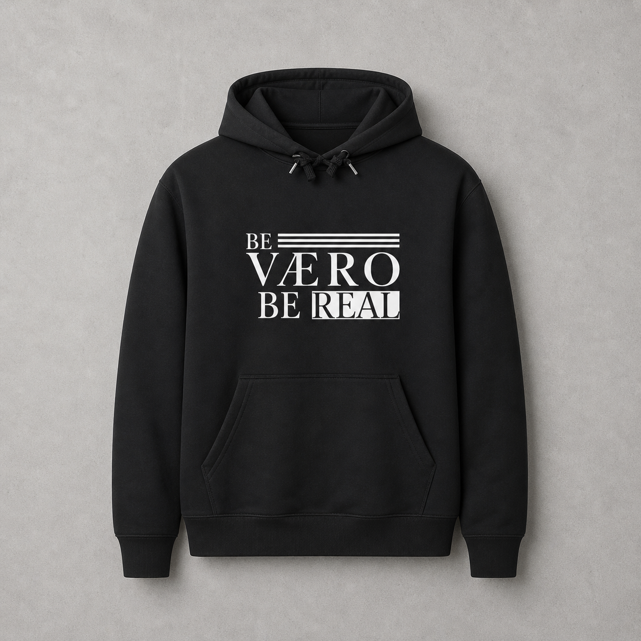 Black hoodie with 'Be Váero Be Real' text on a gray background