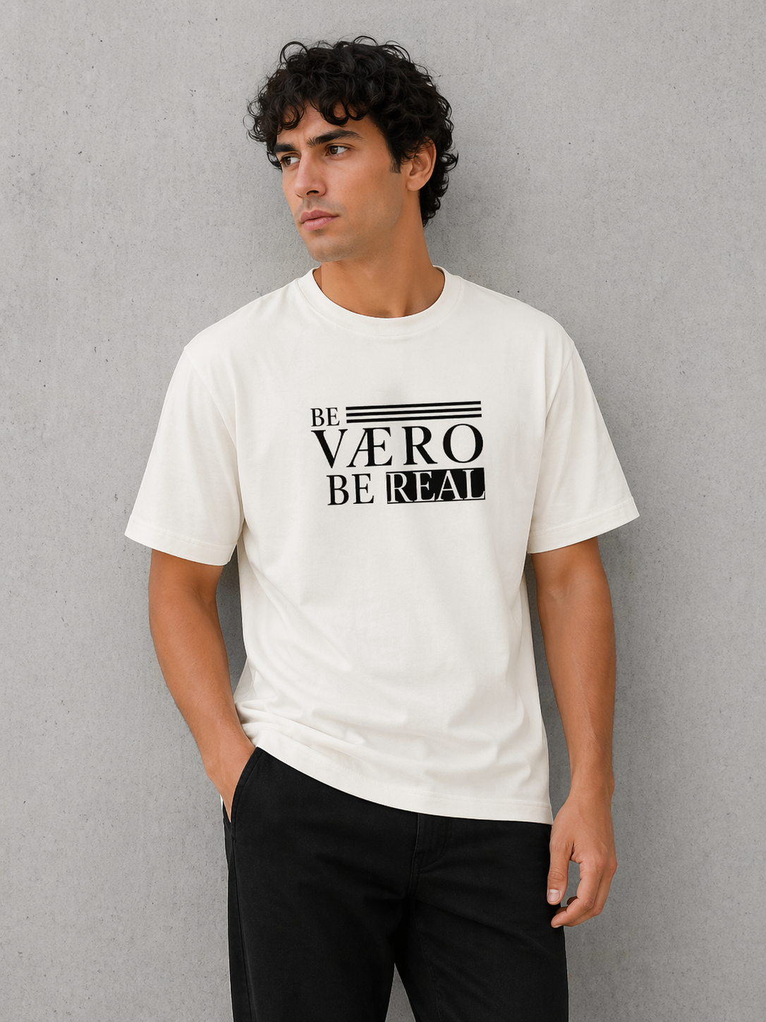 Man wearing a white t-shirt with black text against a gray background
