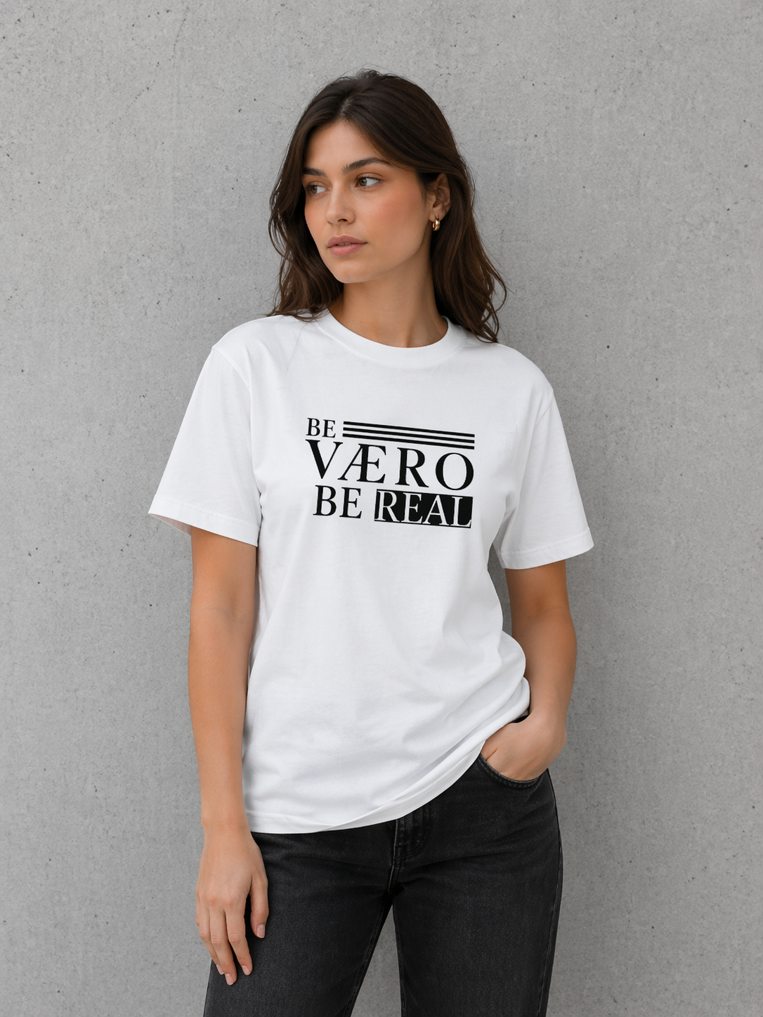 Woman wearing a white t-shirt with black text against a gray background