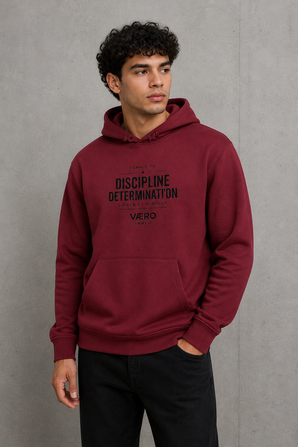 Man wearing a maroon hoodie with text on a gray background