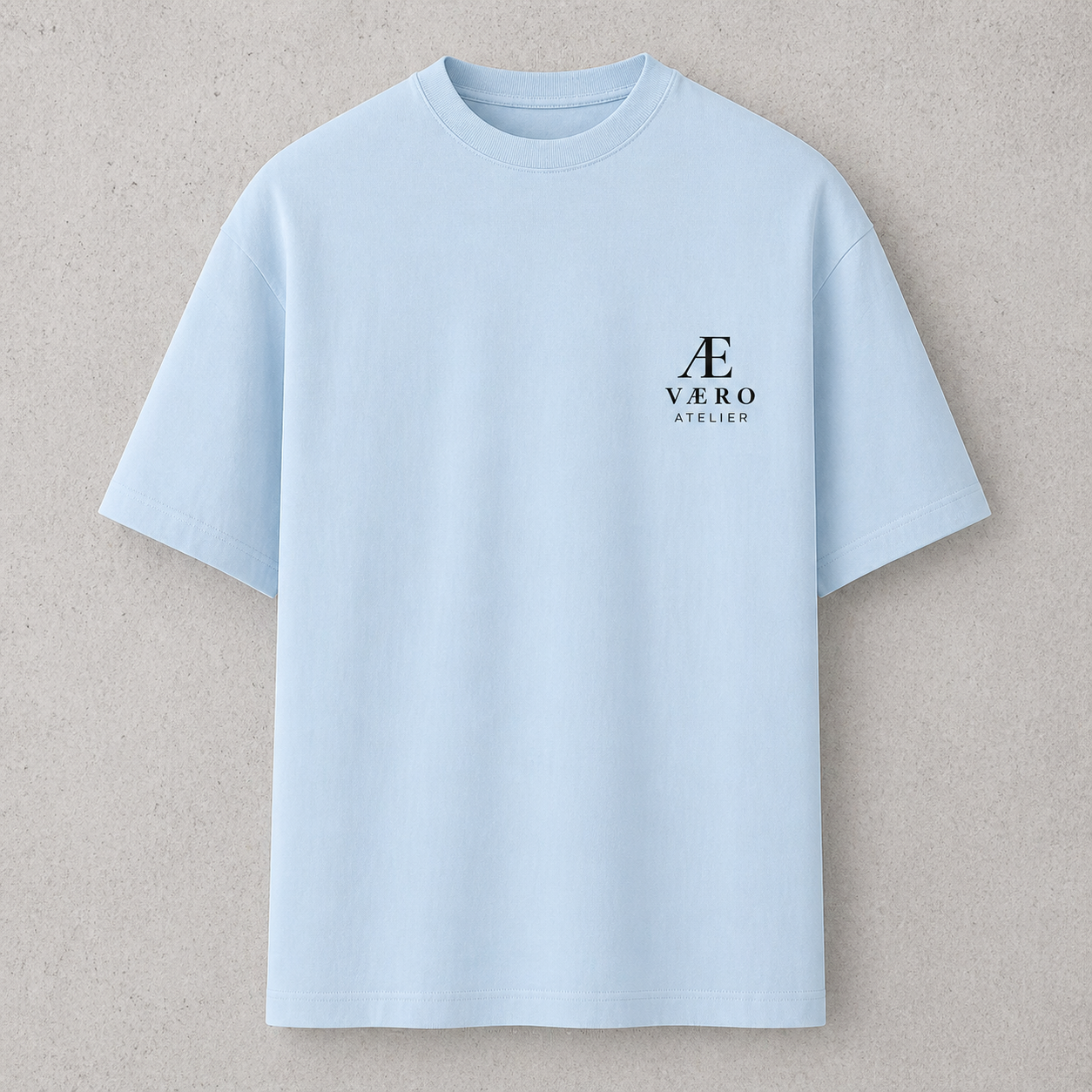 Light blue t-shirt with a logo on a beige background