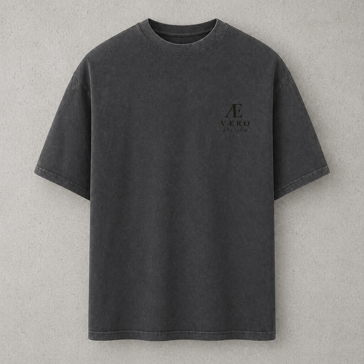 Black t-shirt with a logo on a gray background