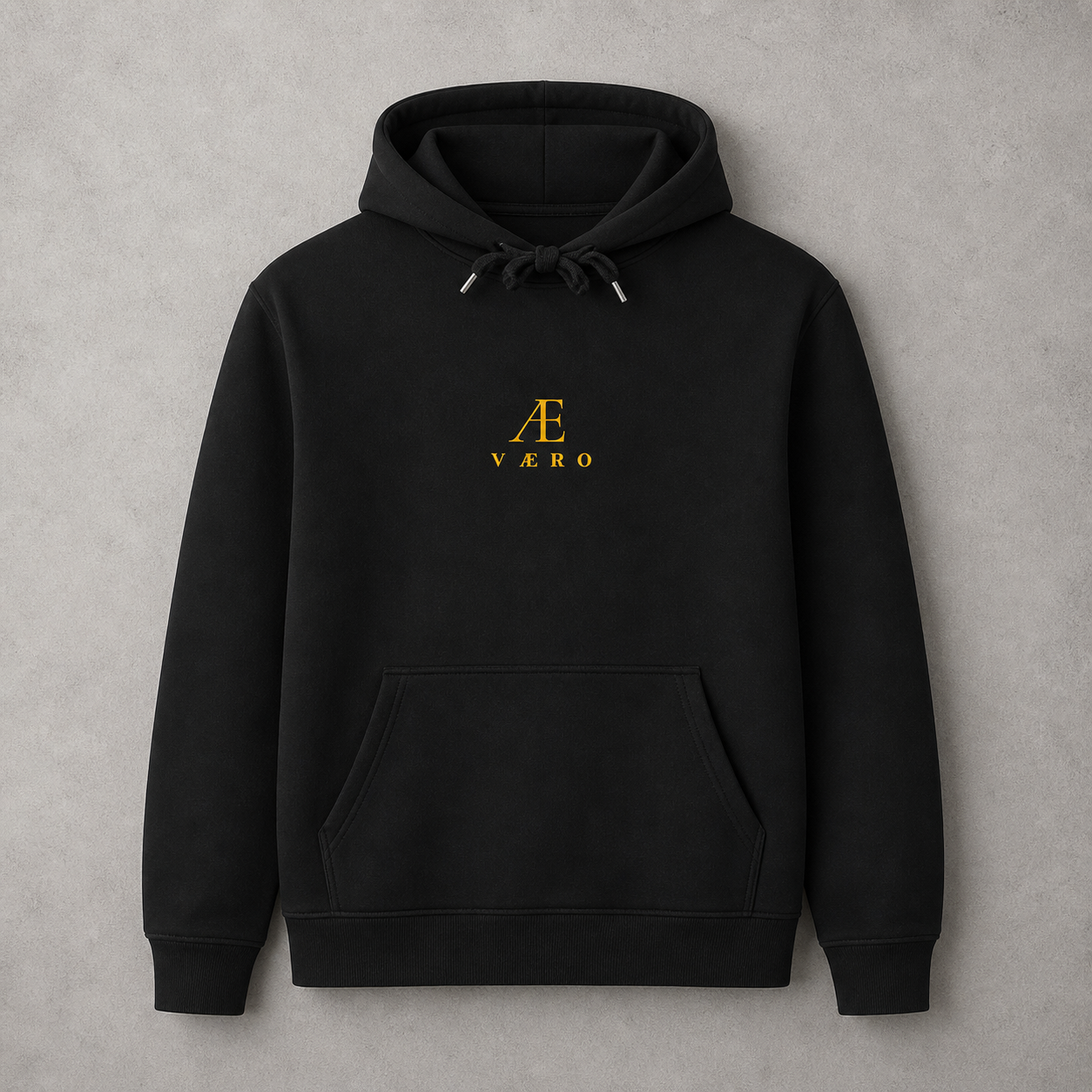 Black hoodie with a gold logo on a gray background