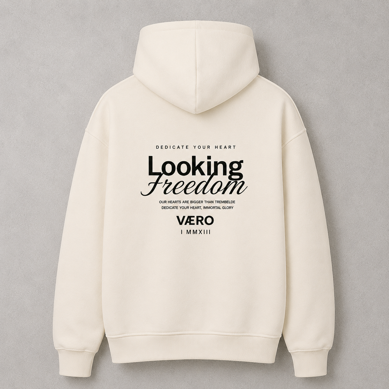 Beige hoodie with 'Looking Freedom' text on the back against a gray background