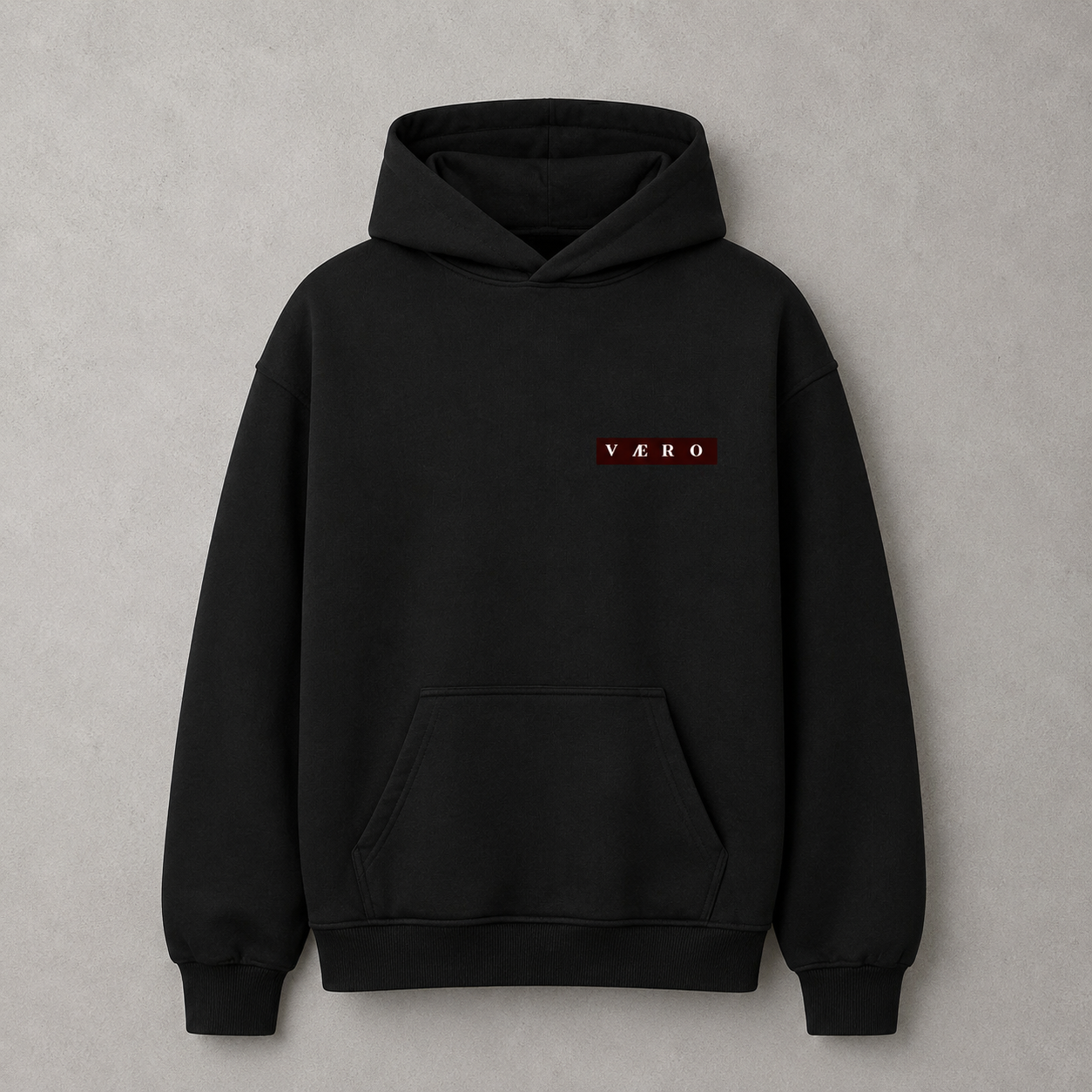 Black hoodie with a red logo on the chest against a gray background