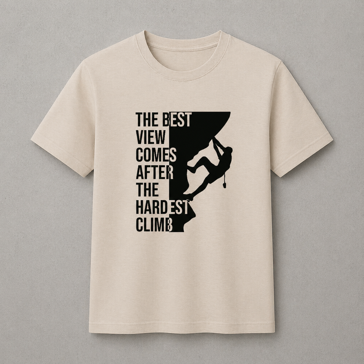 Beige t-shirt with black climbing graphic and text on a gray background