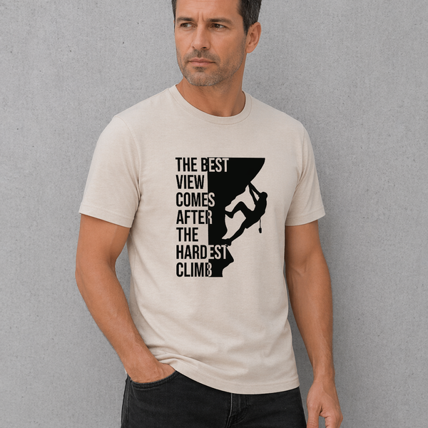 Man wearing a t-shirt with a motivational quote and graphic design against a gray background