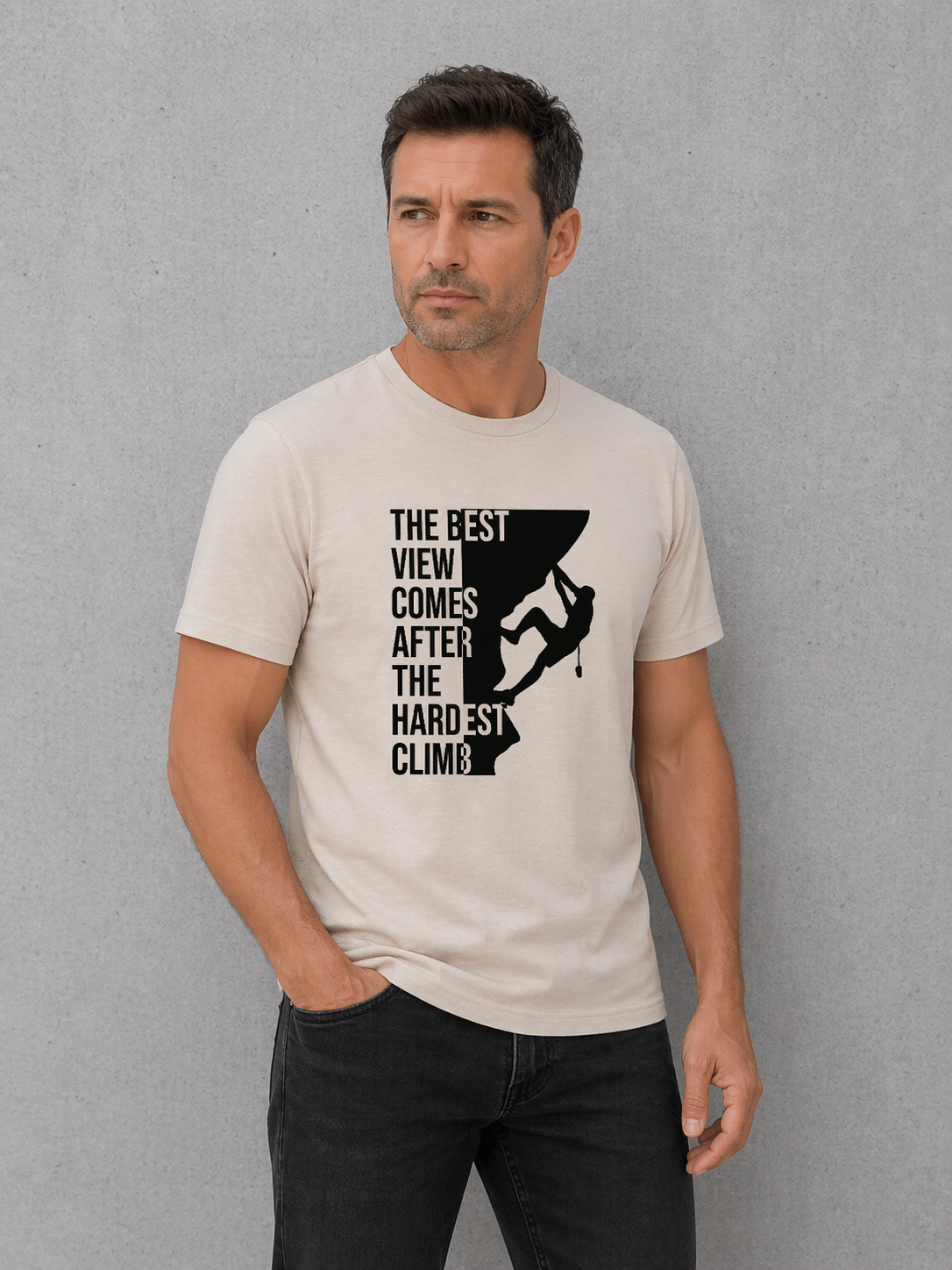 Man wearing a t-shirt with a motivational quote and graphic design against a gray background