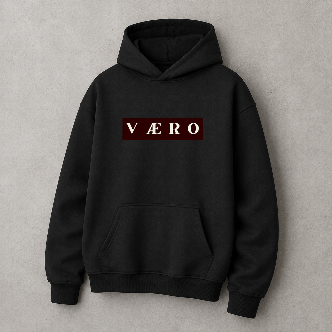 Black hoodie with 'Väero' logo on a gray background
