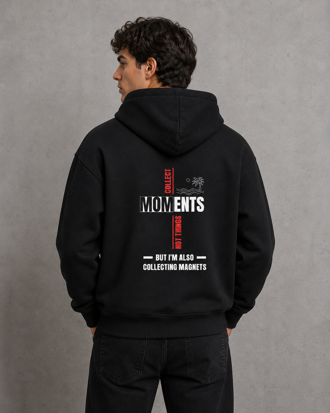 Person wearing a black hoodie with text on the back against a gray background