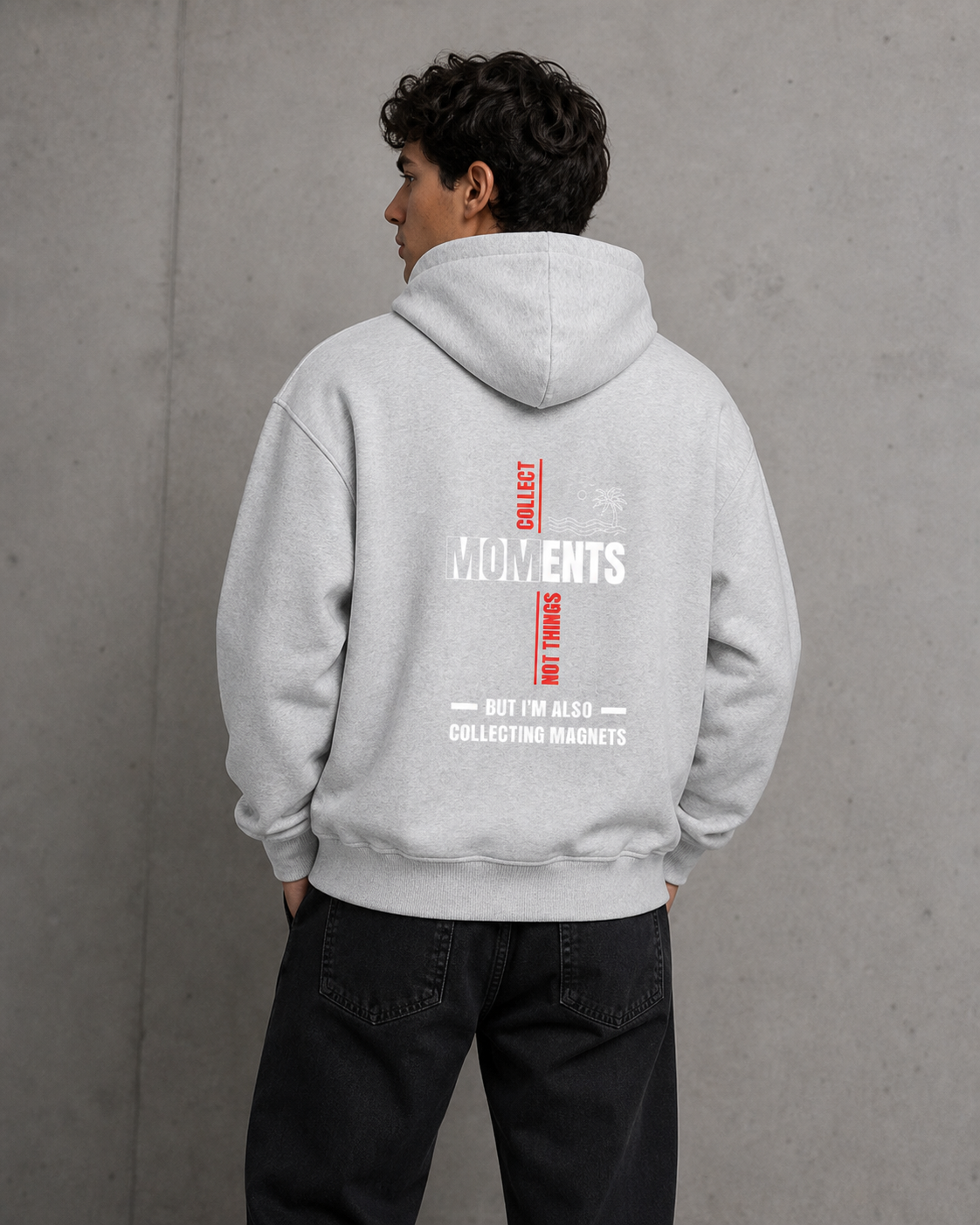 Person wearing a gray hoodie with text on the back against a gray background