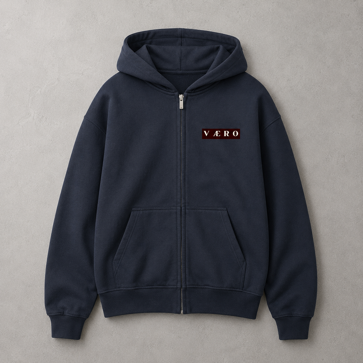 Navy blue hoodie with a brand logo on a gray background