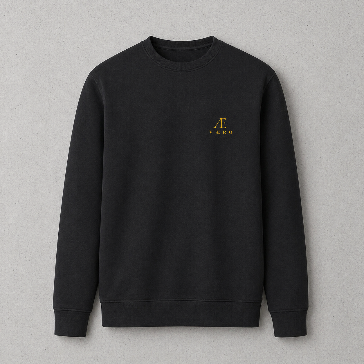 Black sweatshirt with a yellow logo on a gray background