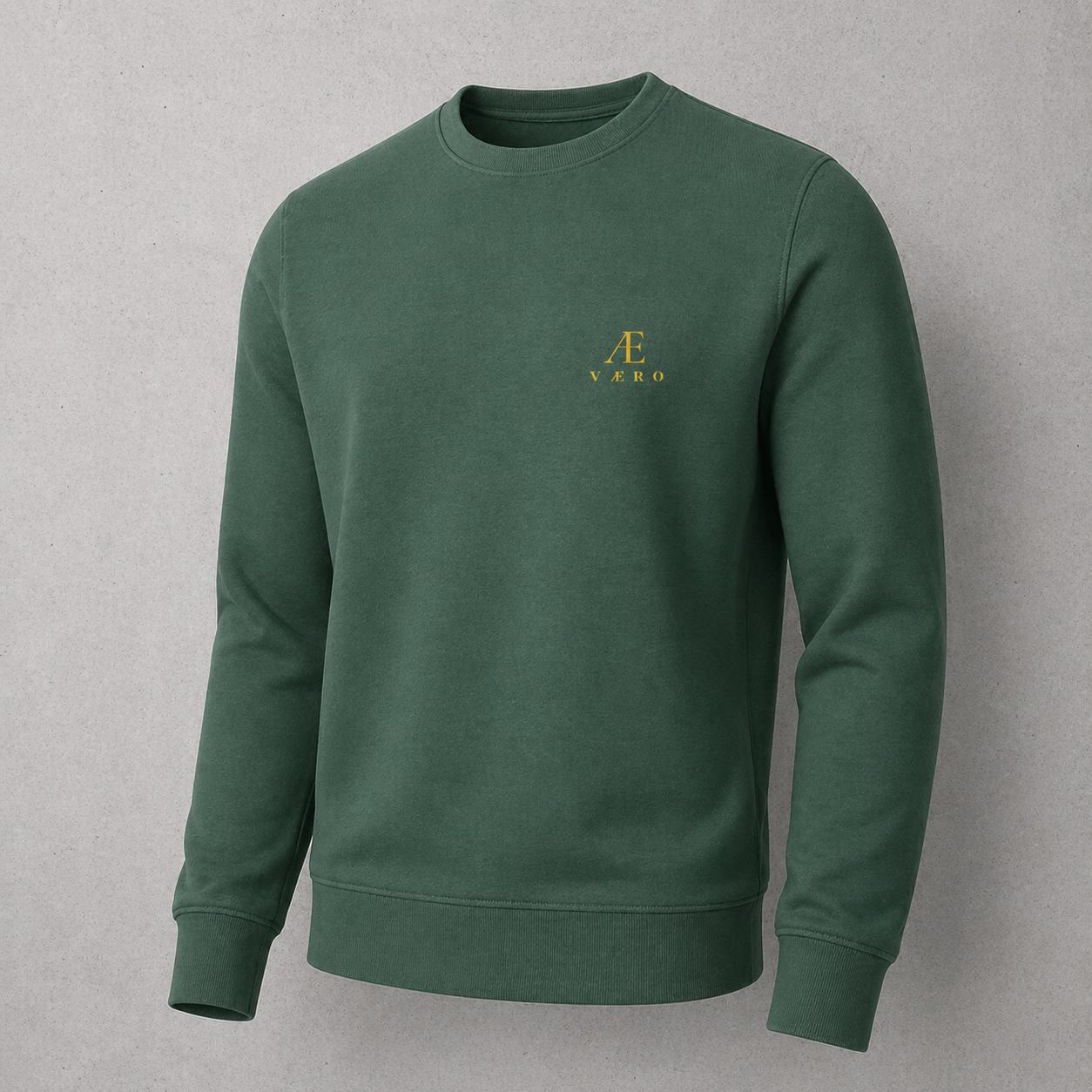 Green sweatshirt with a logo on a gray background