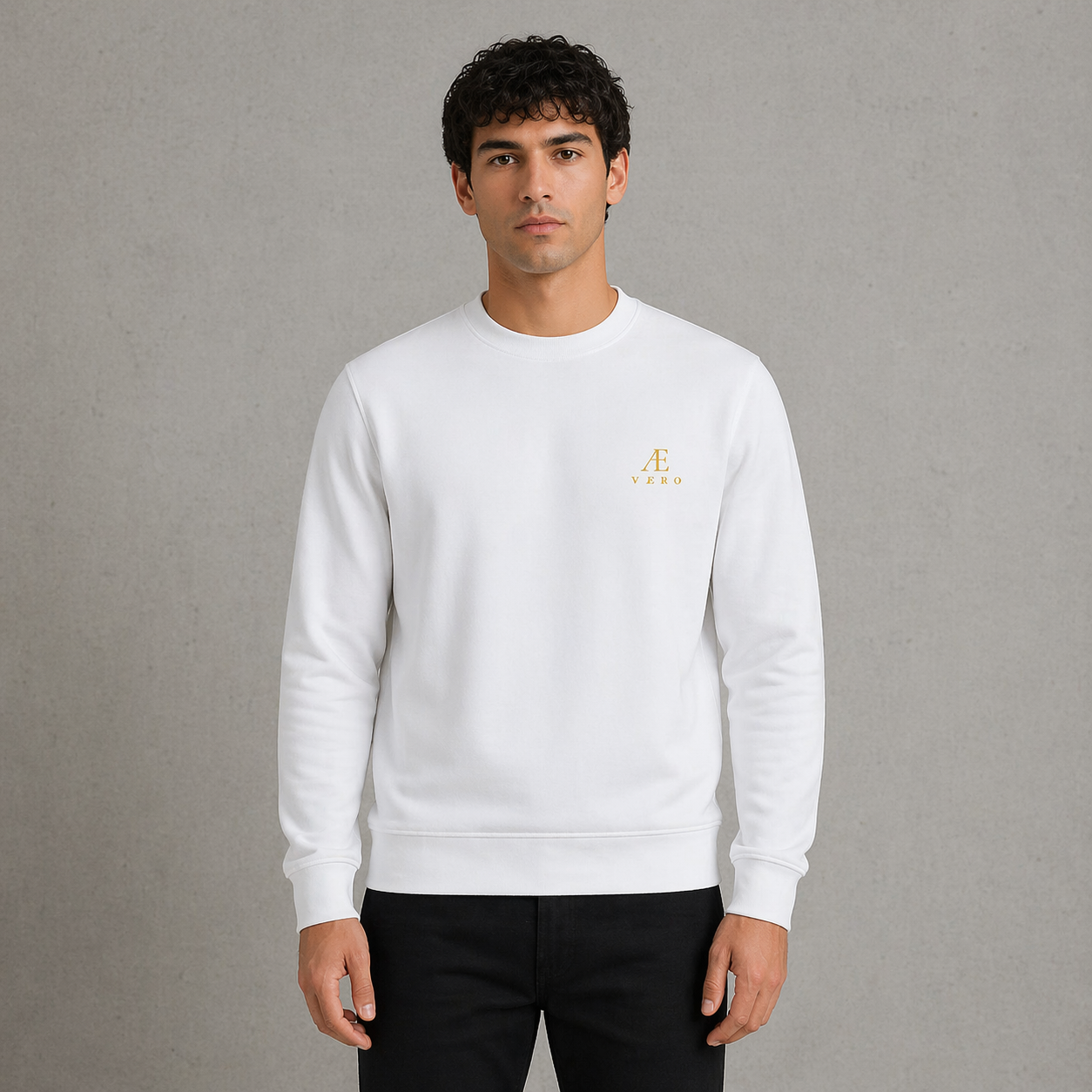 Man wearing a white sweatshirt with a logo on a gray background