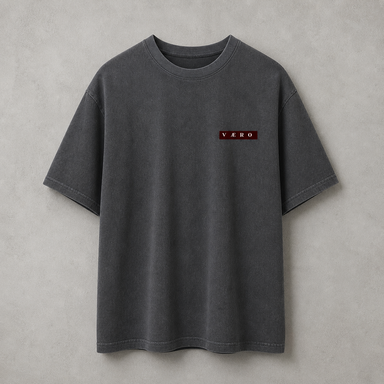 Gray t-shirt with a small logo on a gray background