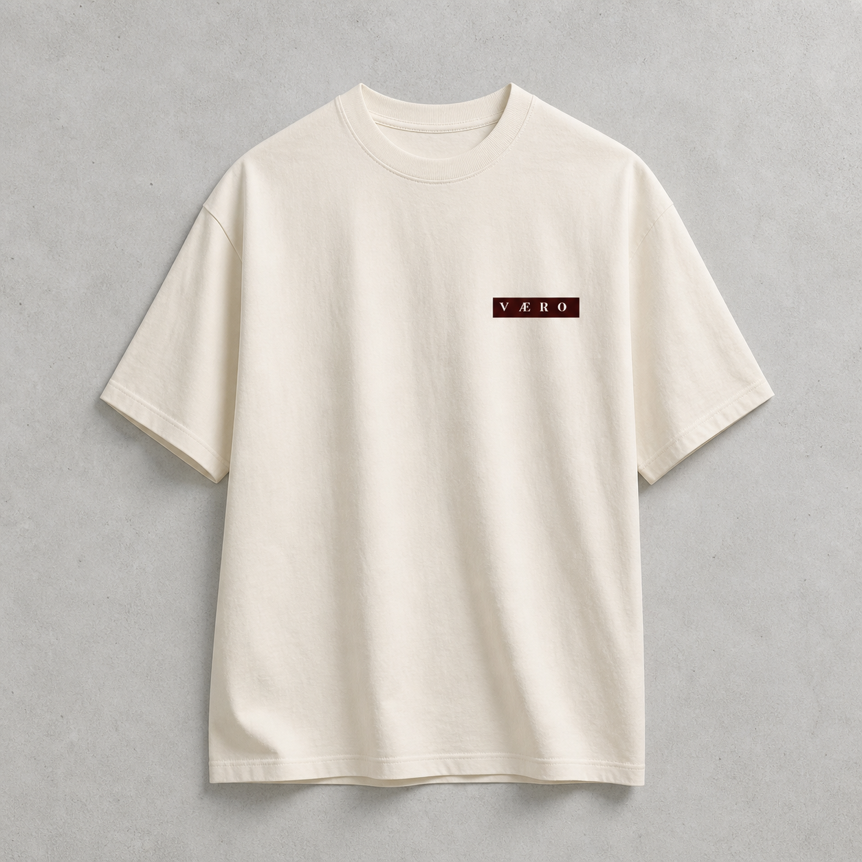 Beige t-shirt with a logo on a gray background