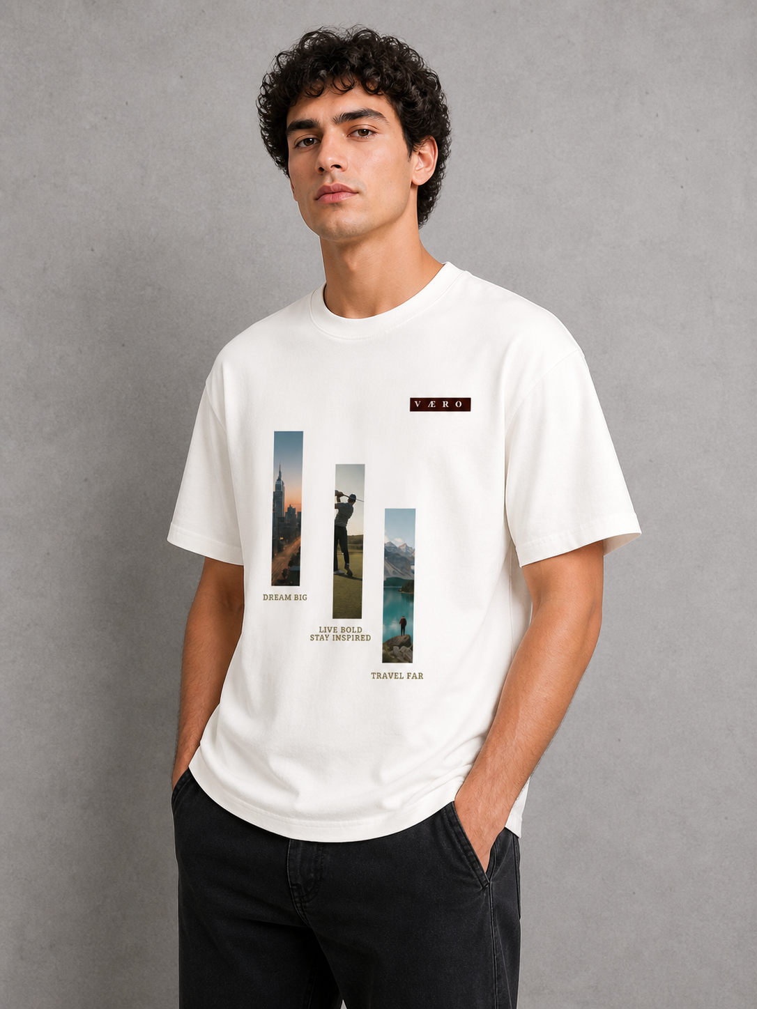 Man wearing a white t-shirt with graphic designs on a gray background