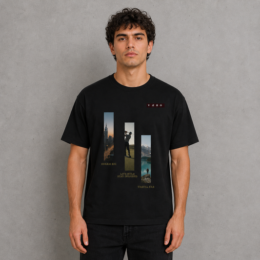 Man wearing a black t-shirt with graphic designs and text on a gray background