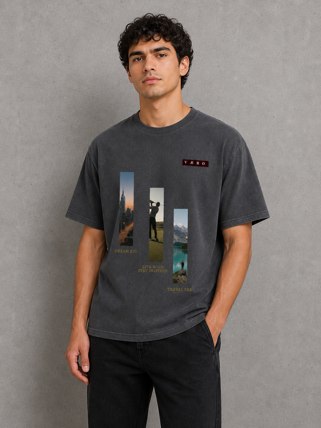 Man wearing a dark gray t-shirt with graphic design against a gray background