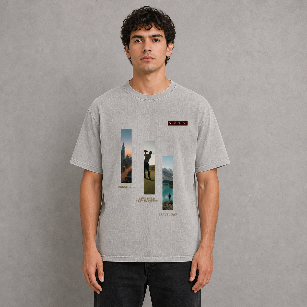 Man wearing a gray t-shirt with a graphic design on a gray background