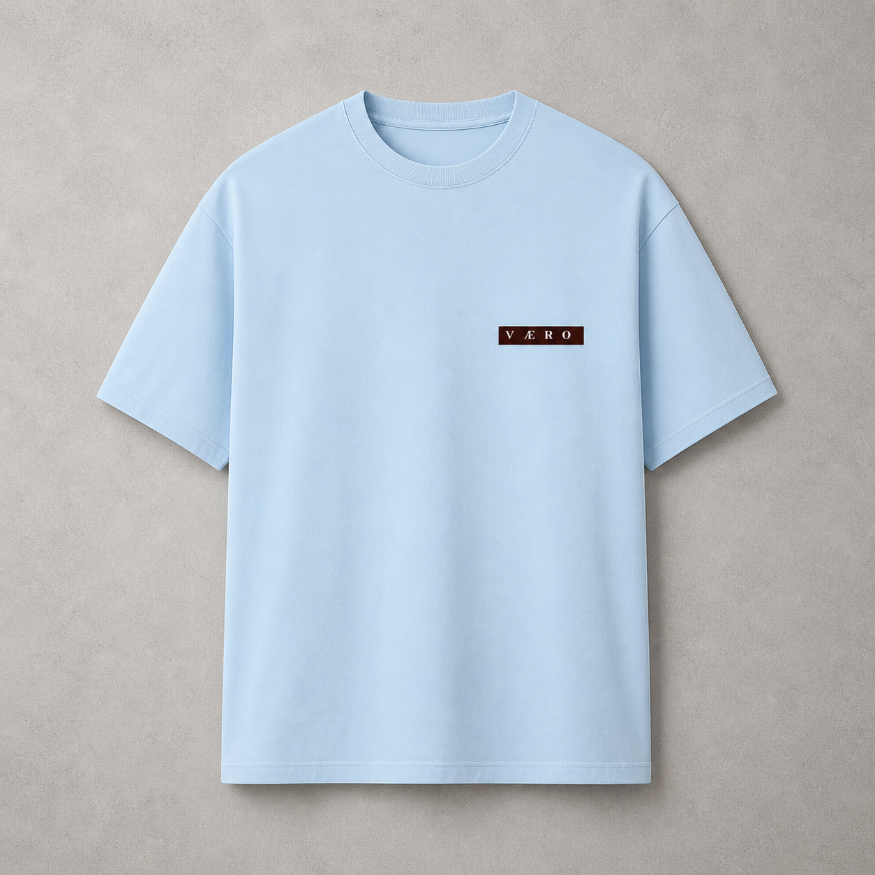 Light blue t-shirt with a logo on a beige background