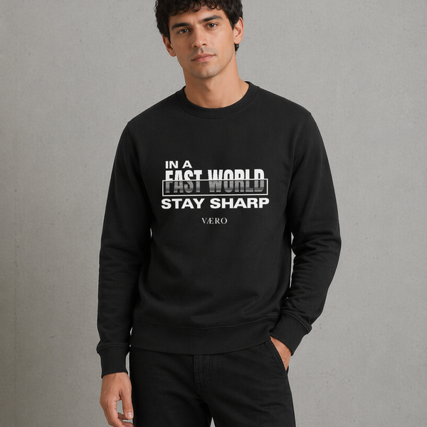 Man wearing a black sweatshirt with text on a gray background