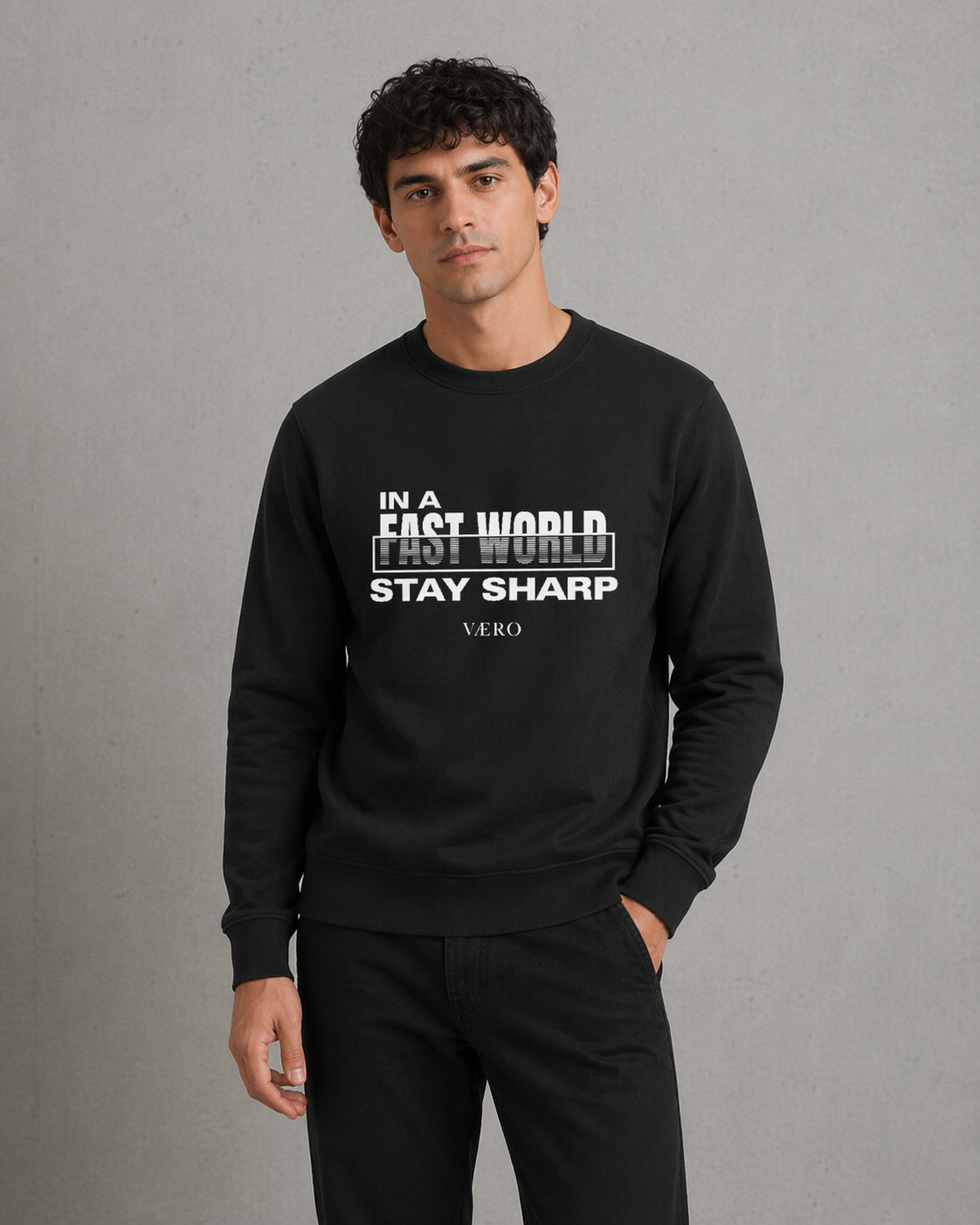 Man wearing a black sweatshirt with text on a gray background