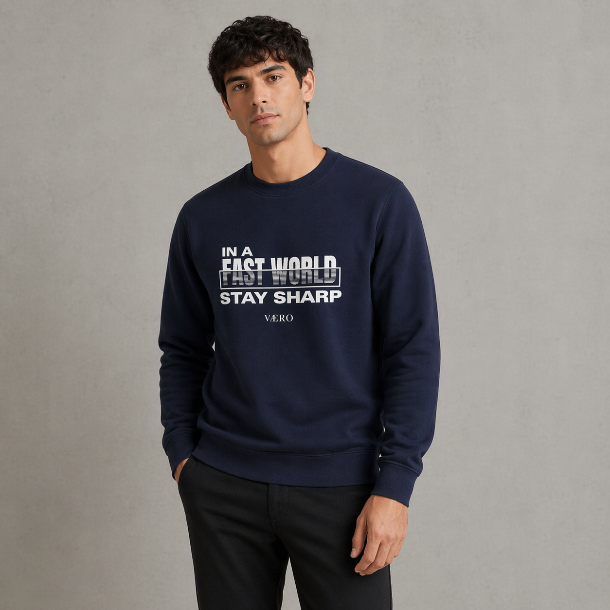 Man wearing a navy blue sweatshirt with text on a gray background