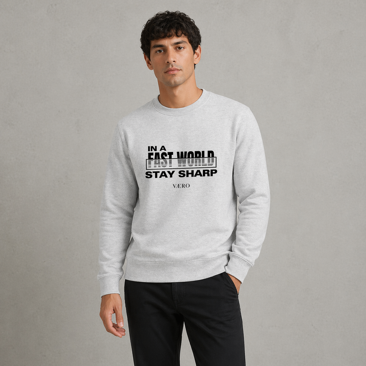 Man wearing a gray sweatshirt with text on a gray background