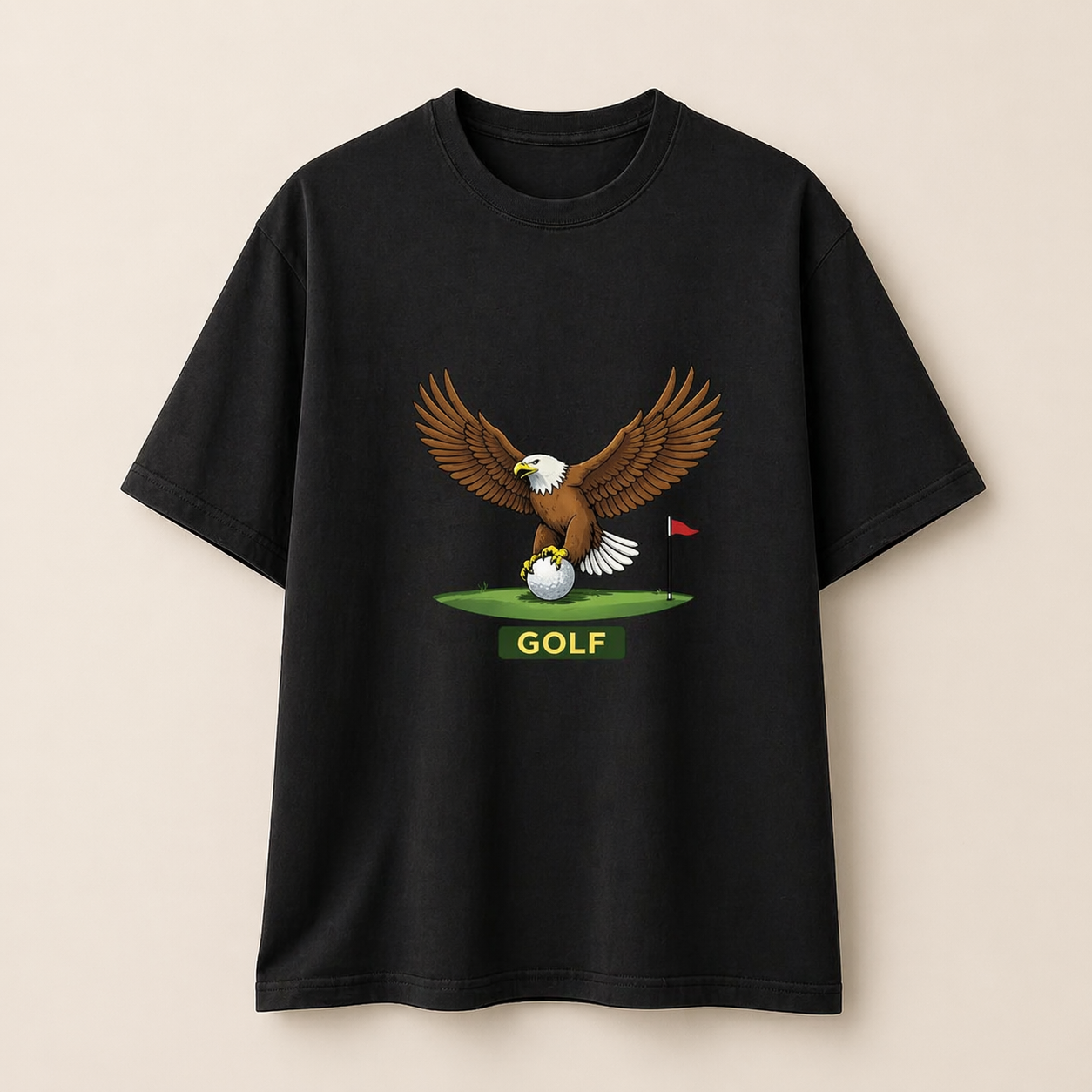 Black t-shirt with an eagle and golf ball graphic on a beige background