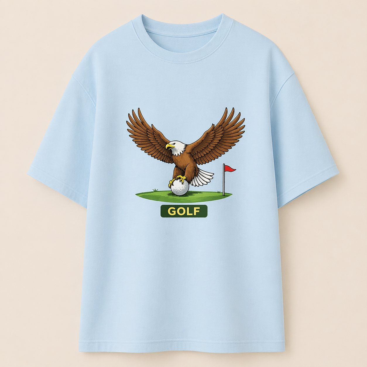 Light blue t-shirt with an eagle and golf ball graphic on a beige background