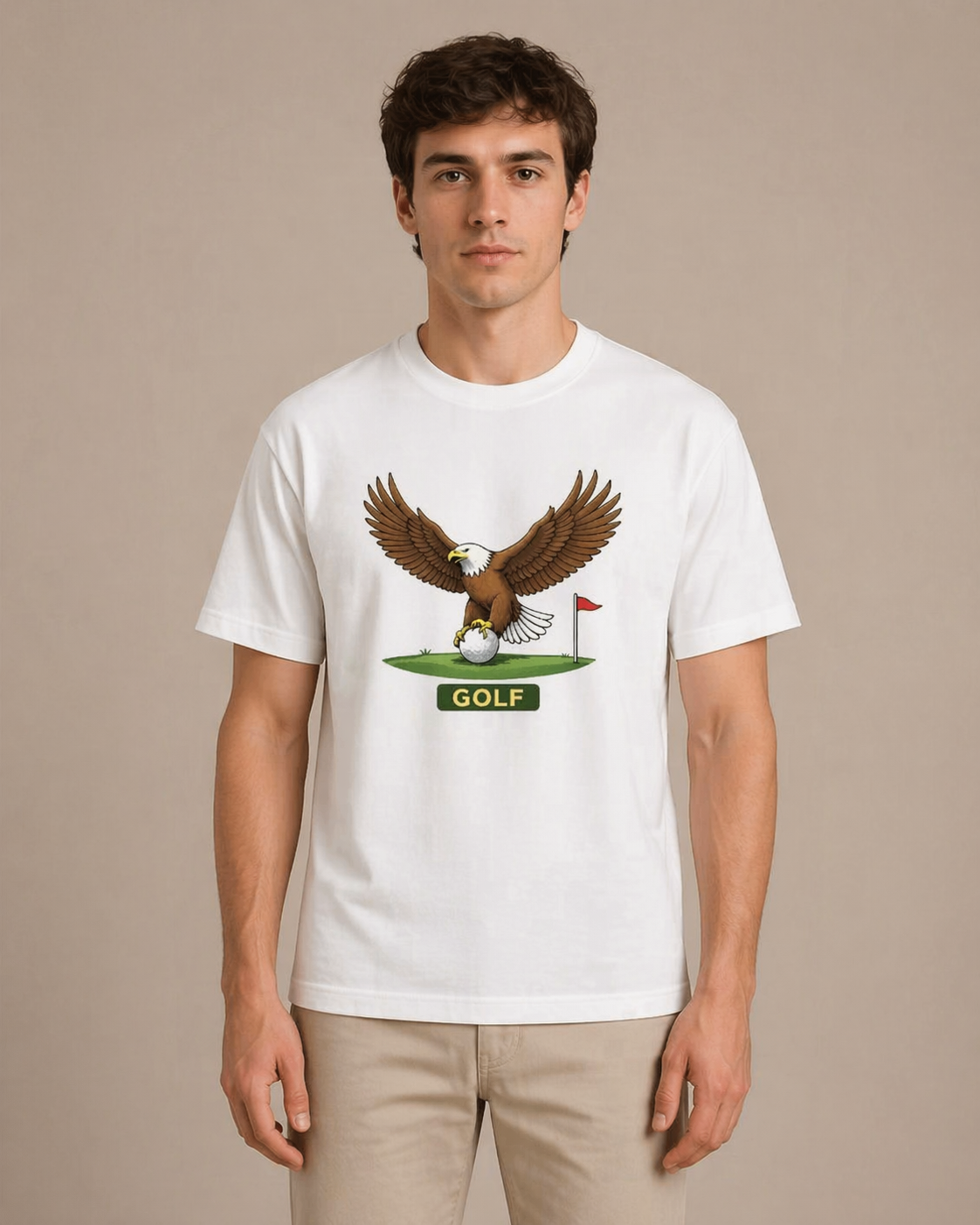 Person wearing a white t-shirt with a graphic of an eagle and golf ball on a beige background