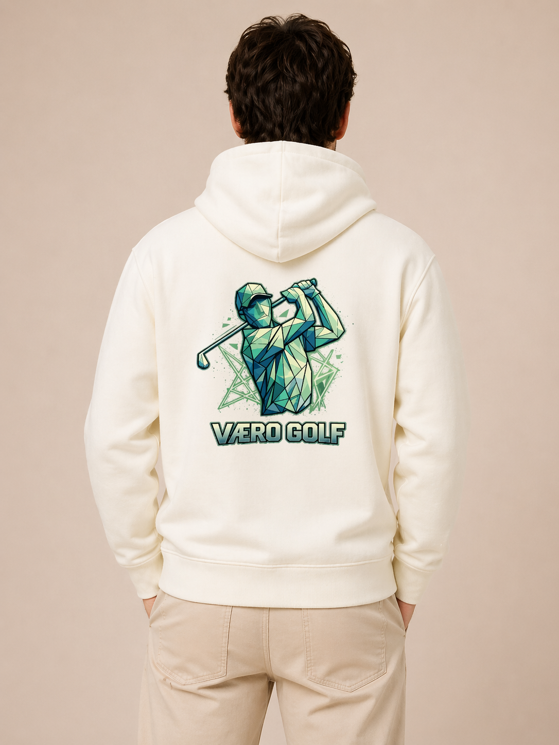 Person wearing a white hoodie with a golf-themed design on the back against a beige background